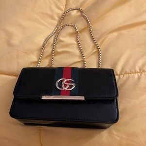 Small black handbag. Great for outings and look fashionably chic.